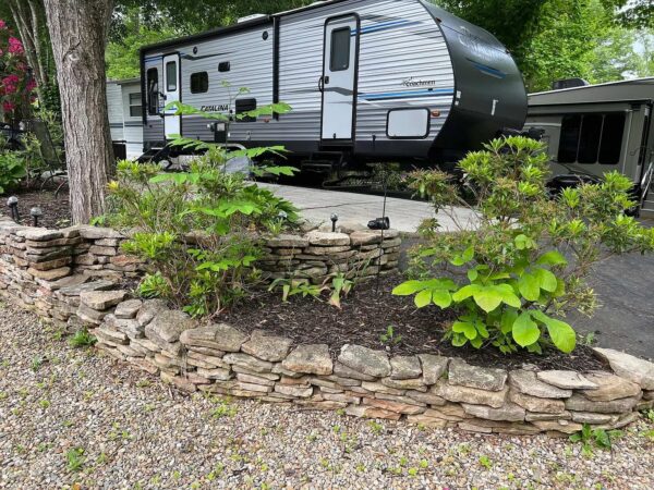 Deluxe Hillside site's landscaping and concrete patio